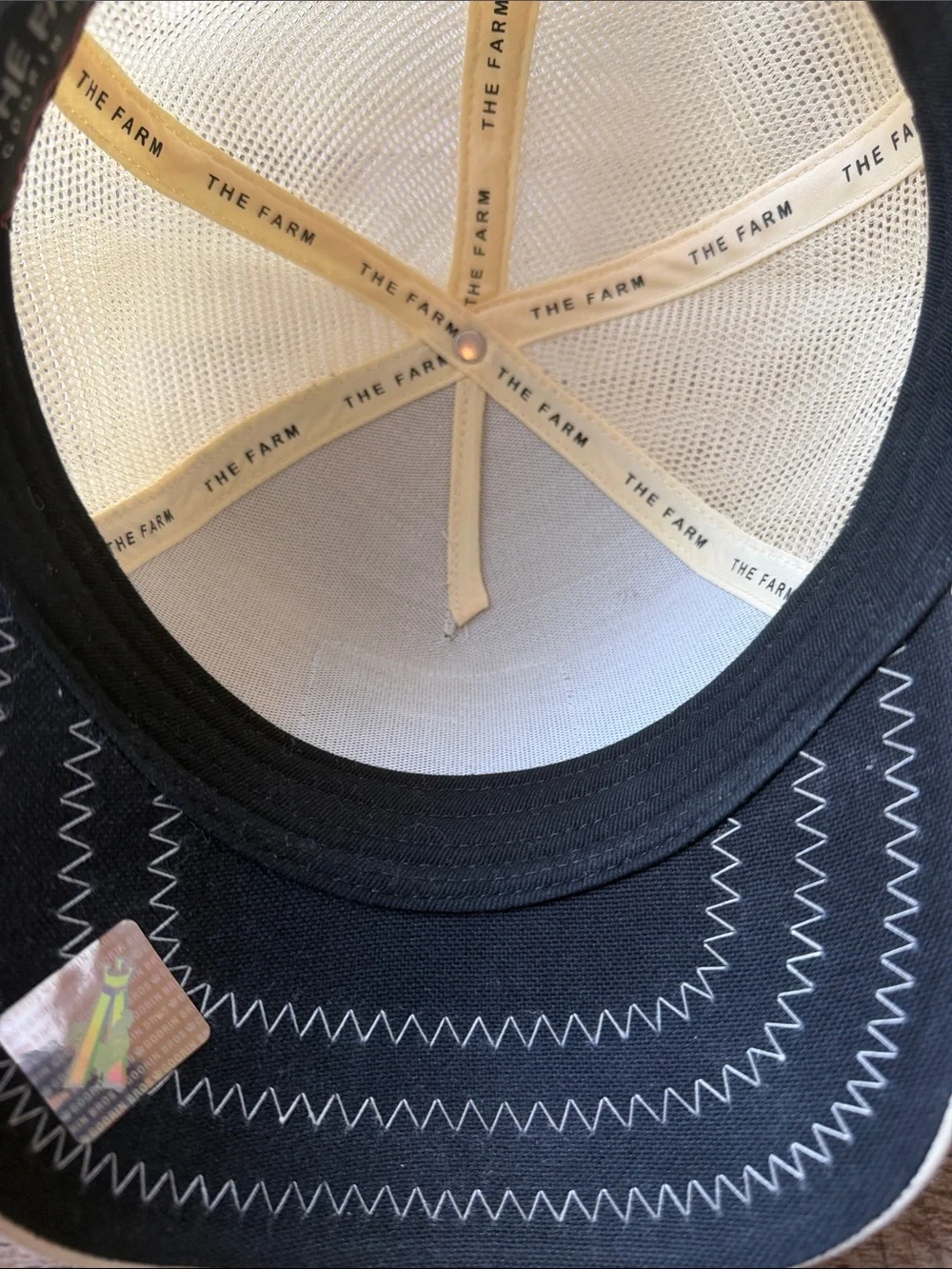 Goorin Bros Cream Trucker Hat with Brown Snake Patch